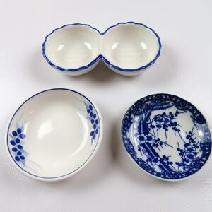 4 small white and blue condiment sauce spices olives nuts dishes / serveware